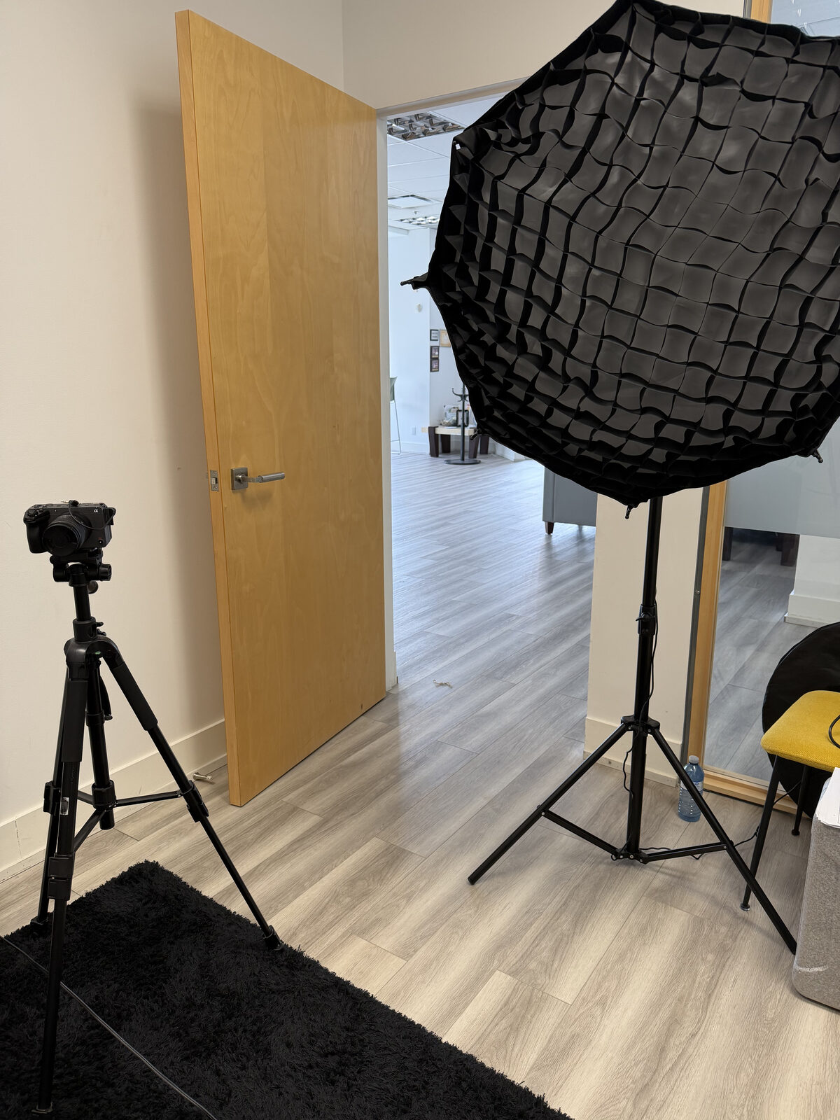 Professional camera and softbox lighting setup in the Next Up Marketing studio